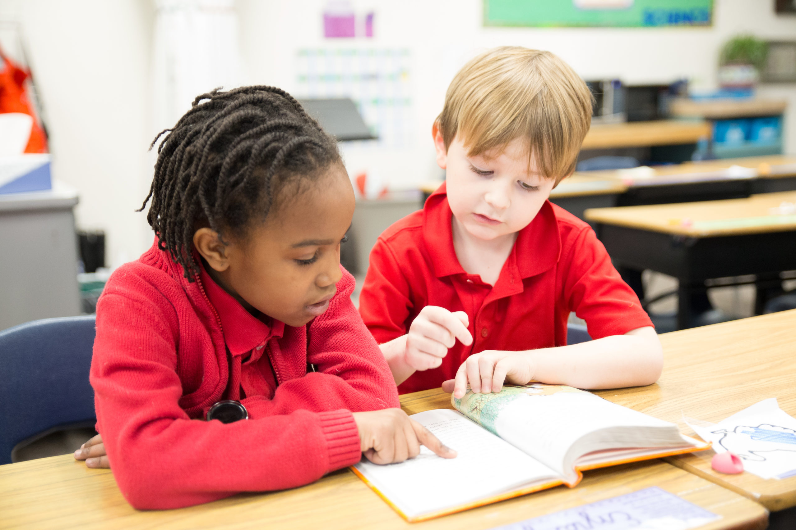 young students reading and studying at the Vanguard School