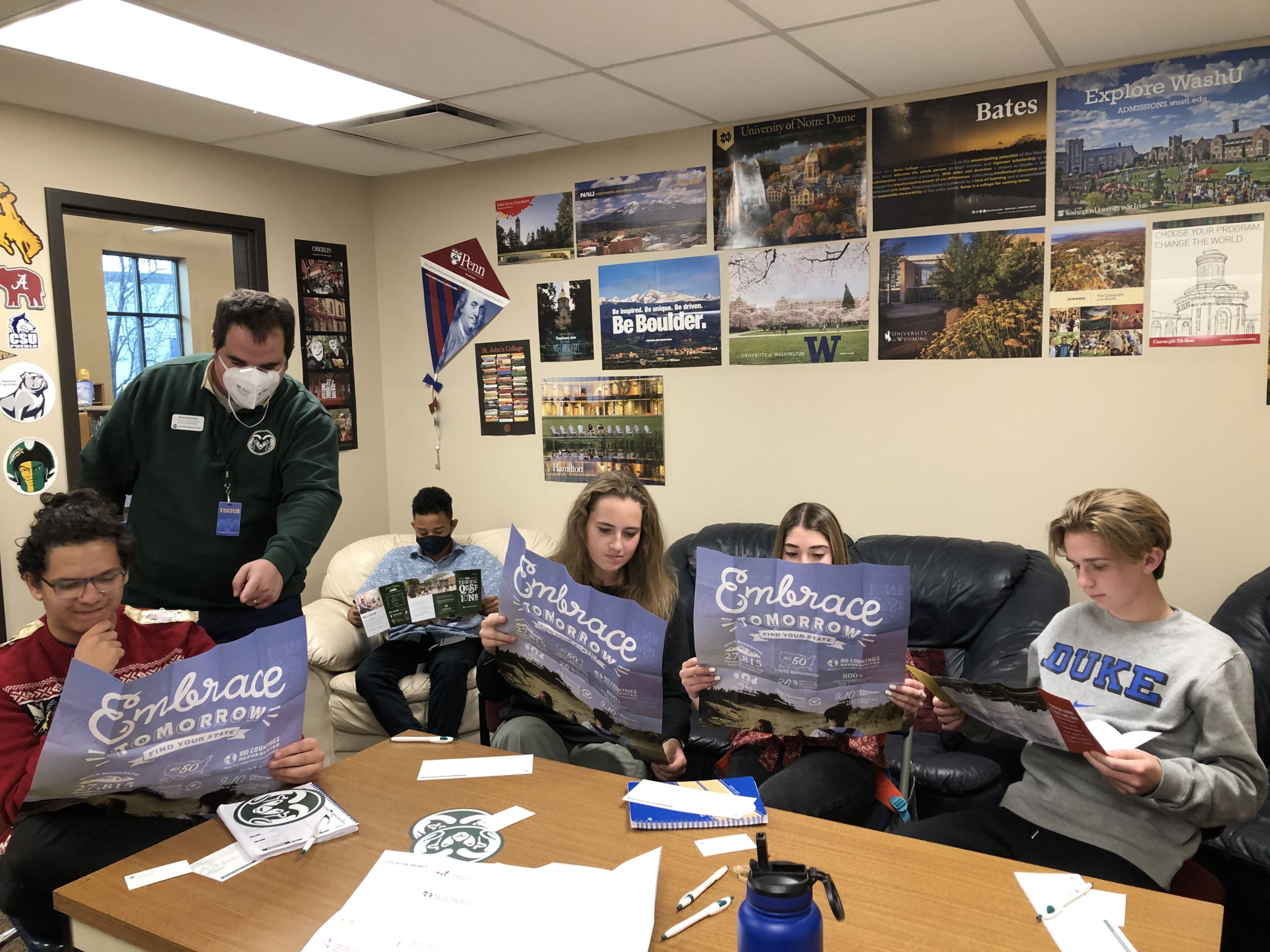 High schoolers at The Vanguard School sitting around a table in the College Counseling office